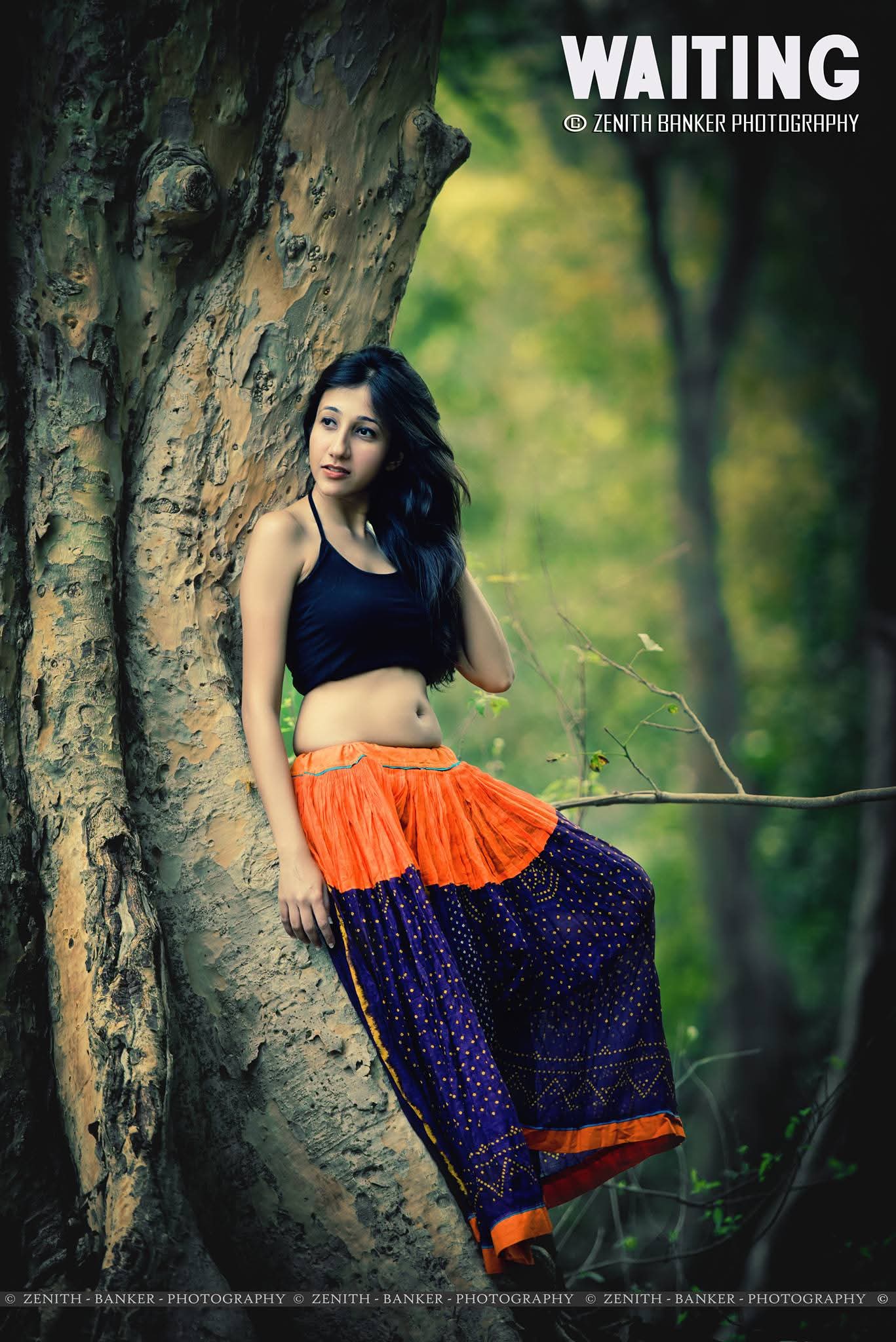 Casual lifestyle pose by Dhwani Dalal sitting on natural terrain for a portfolio update.