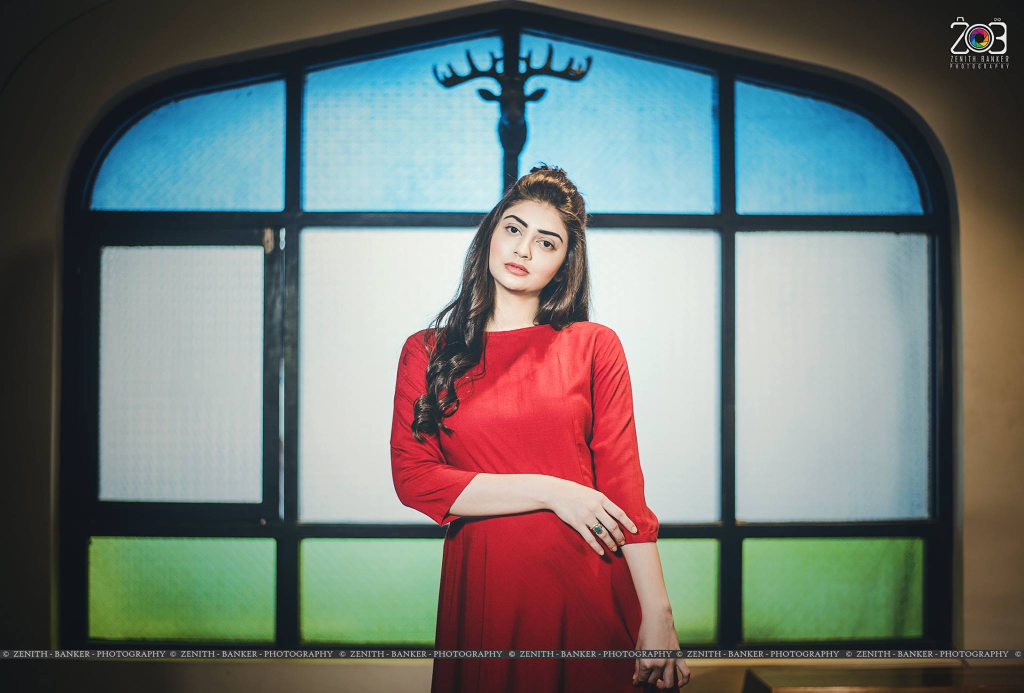 Pensive looking away pose by Nazia Davidson for fashion portrait photography.