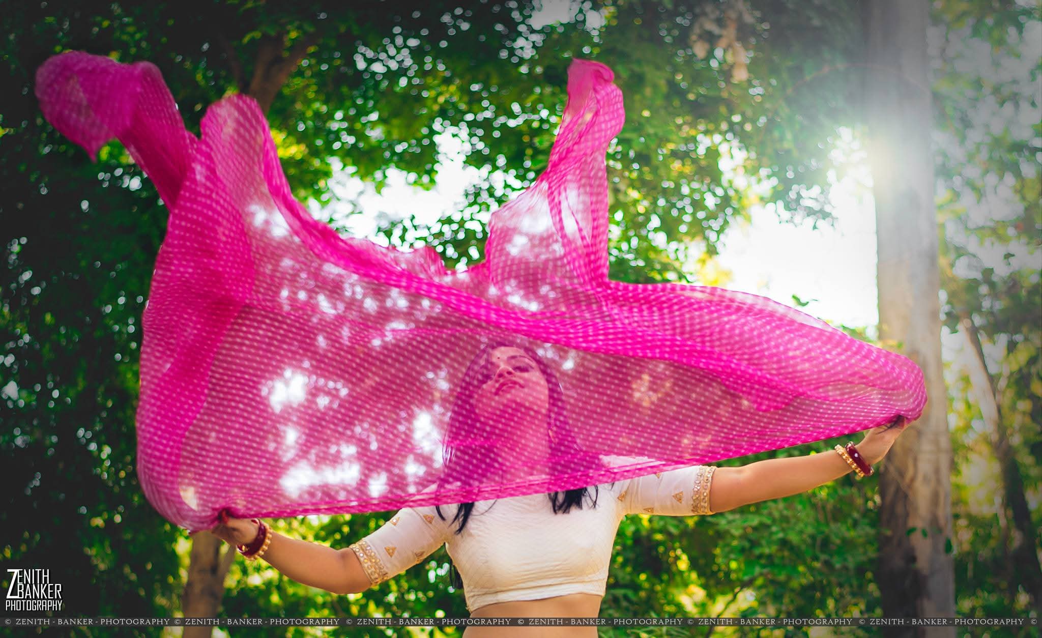 RJ Radhika walking on an Ahmedabad street wearing modern street-style clothing.