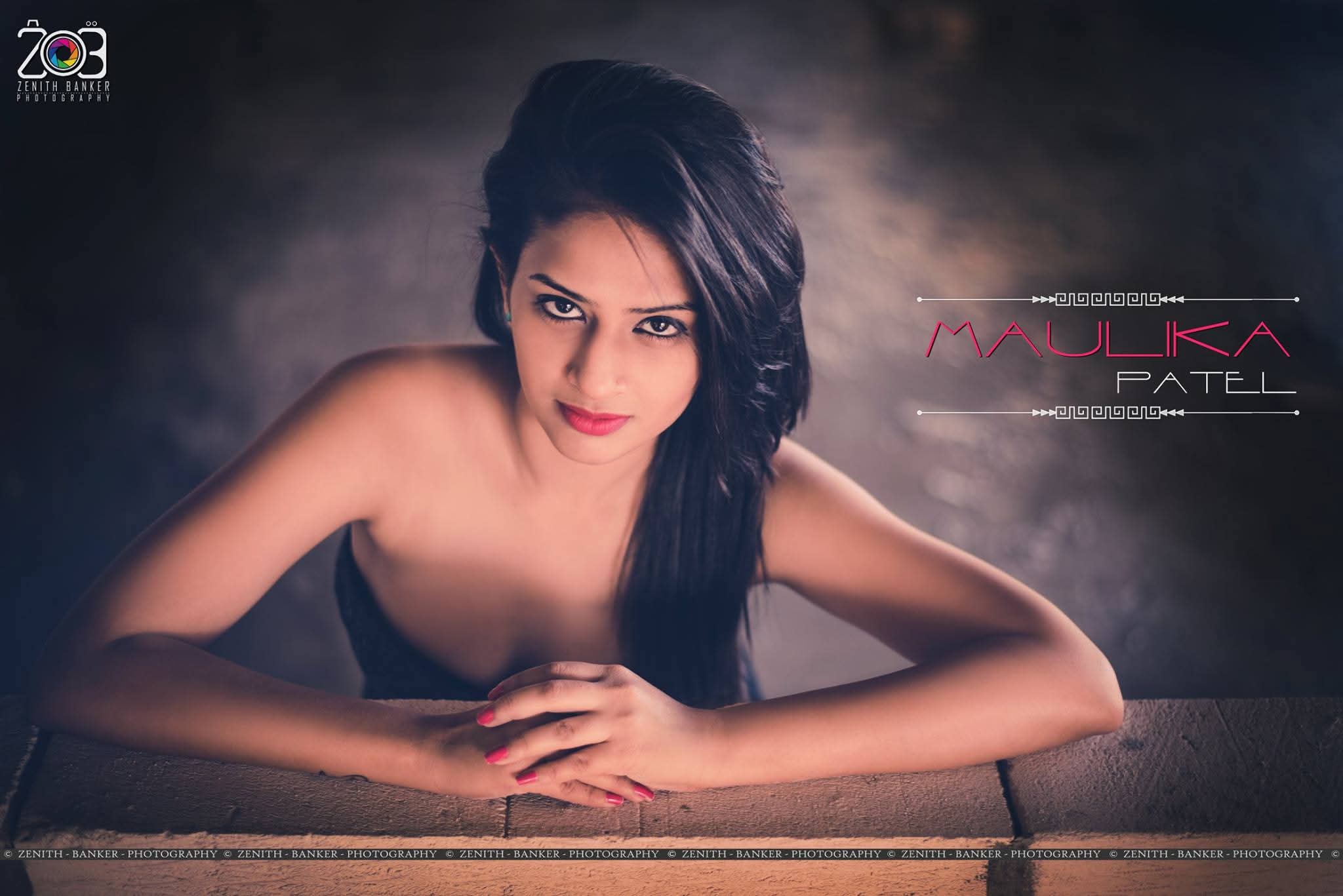 Dramatic side profile of actress Maulika Patel with blurred nature background.
