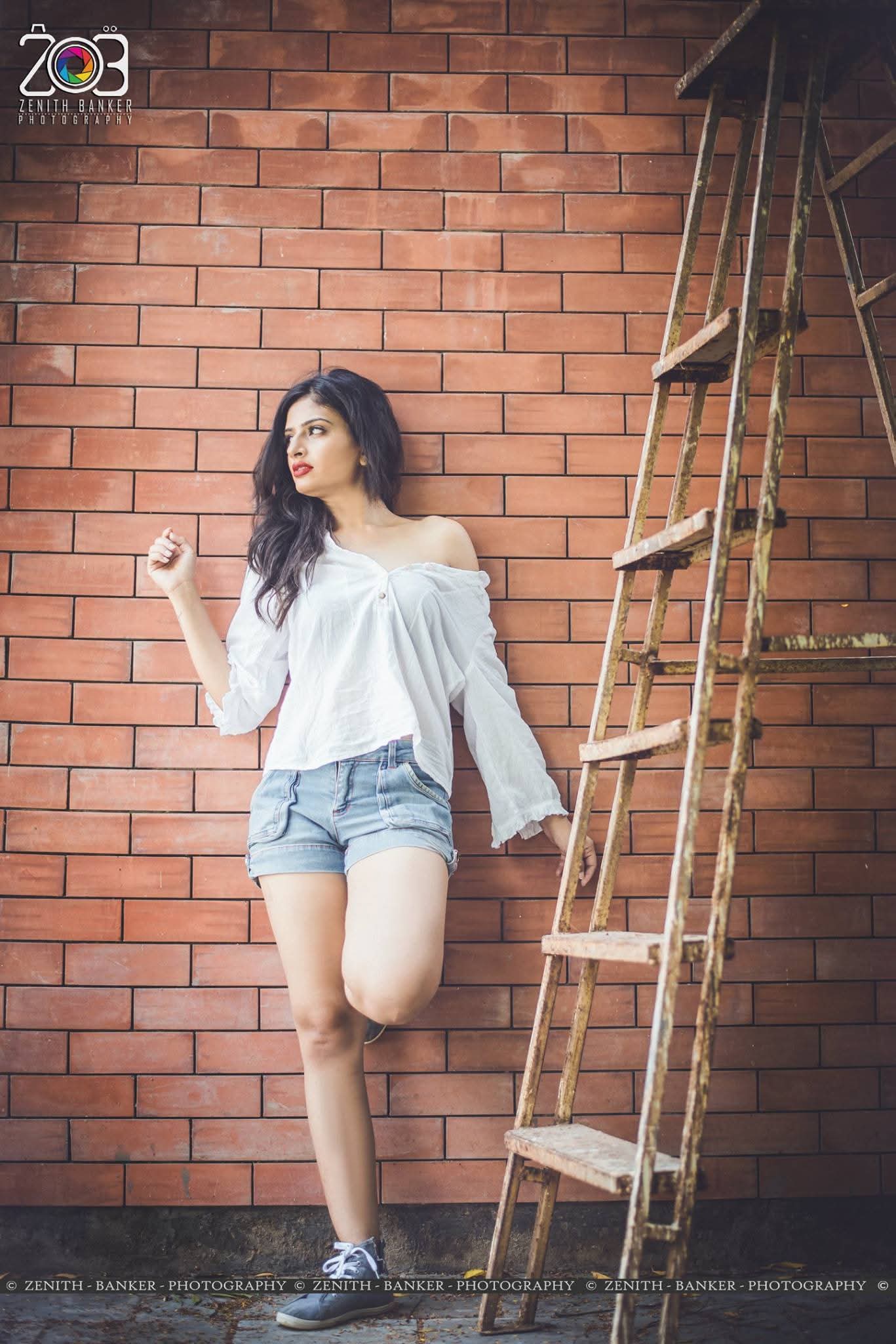 Confident pose by Gujarati actress Maulika Patel looking directly at the camera.