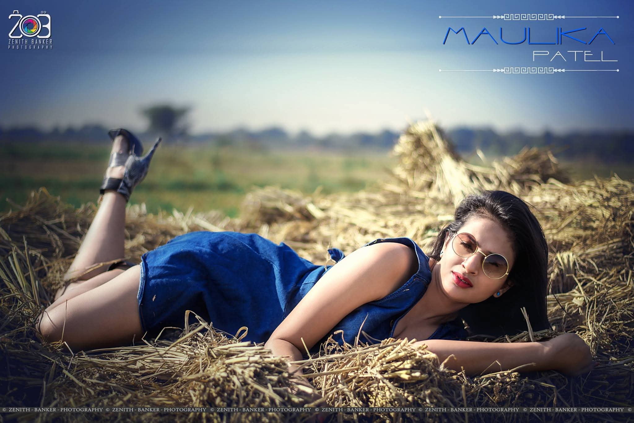 Candid photography of Maulika Patel laughing during an outdoor fashion shoot.